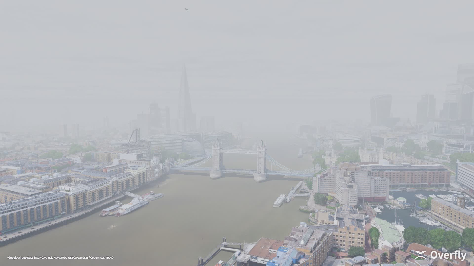 Overfly screenshot: Tower Bridge in fog, the far bank fading to white