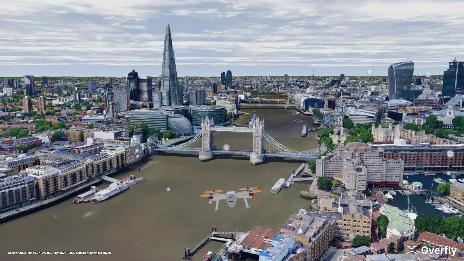 Overfly screenshot: Tower Bridge under a gust warning, the drone leaning into the wind