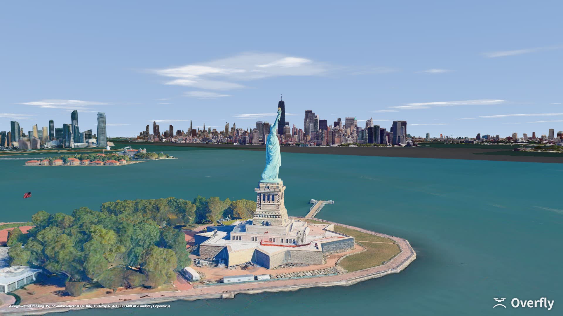 Overfly screenshot: the Statue of Liberty with the Lower Manhattan skyline behind it