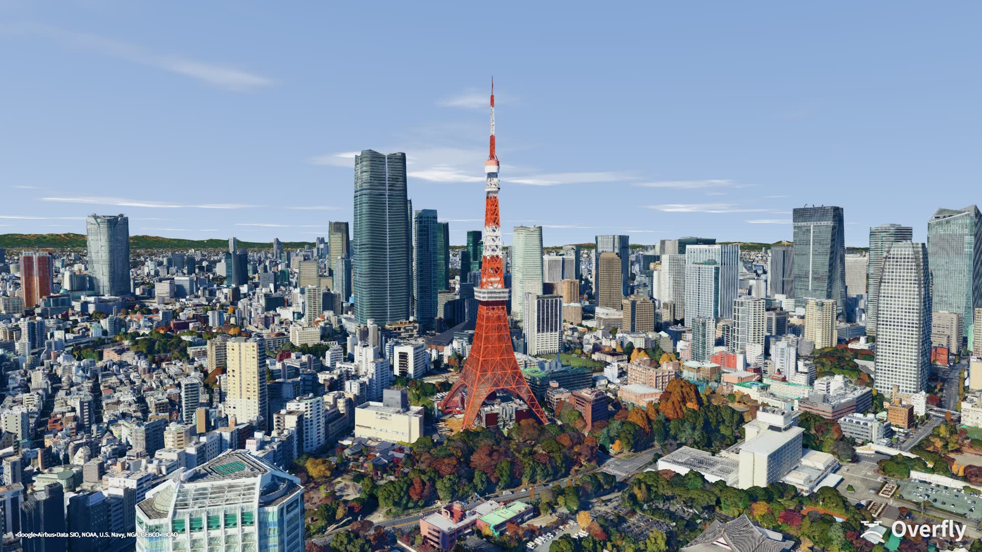 Overfly screenshot: Tokyo Tower rising above the city, seen from the south